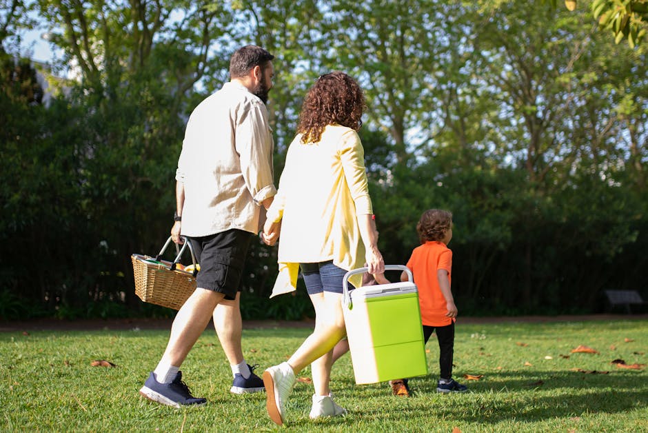 Family picnic in Adelaide parklands with children playing