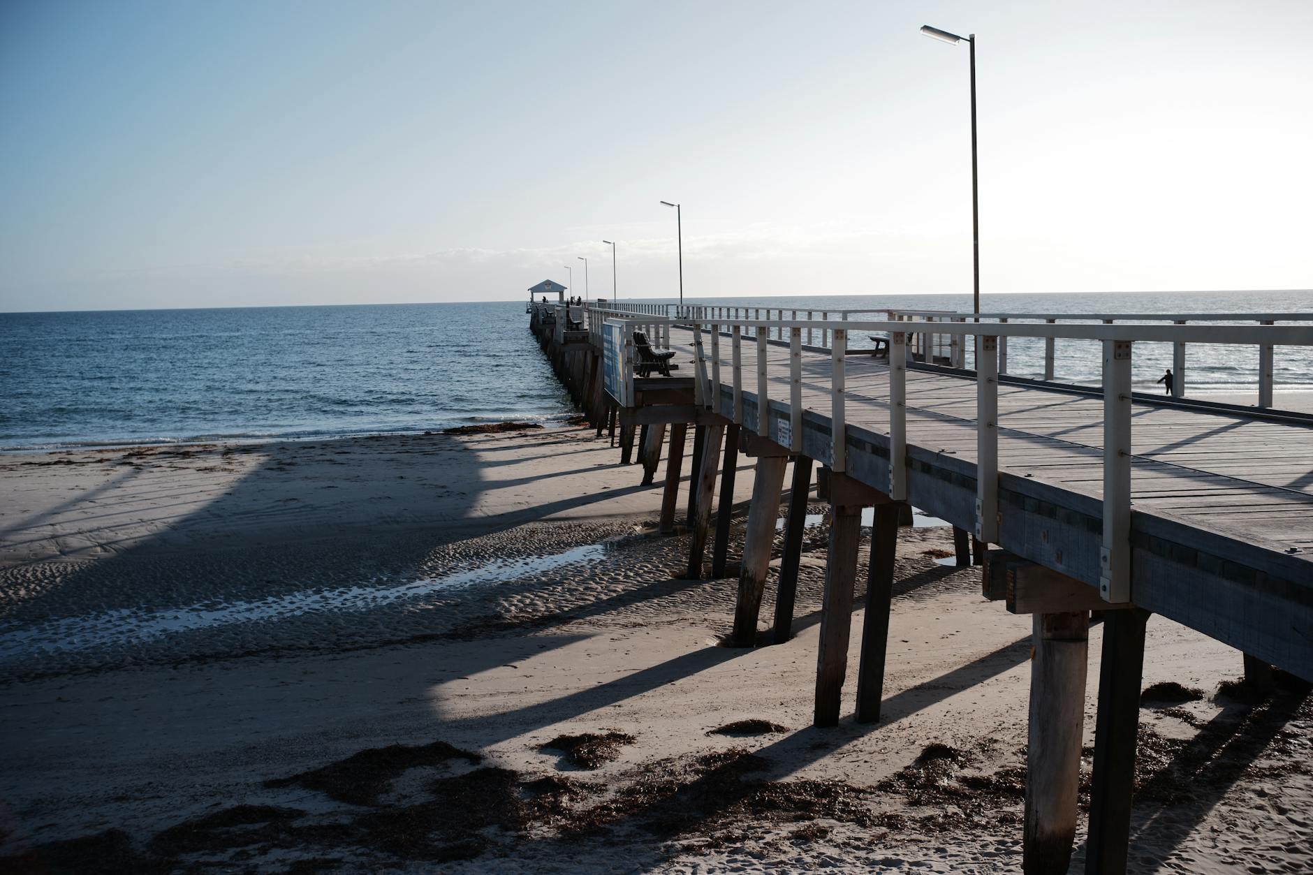 Glenelg Beach on Adelaide's coastline with golden sand and clear blue water, Adelaide's most popular beach suburb
