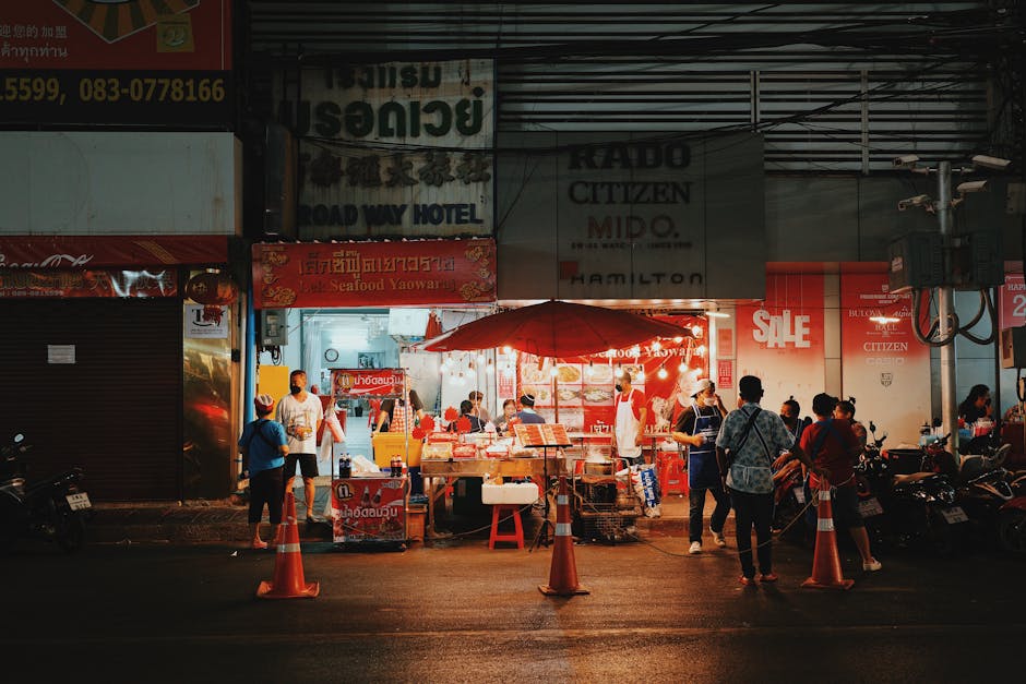 Night market with street food stalls and evening crowds