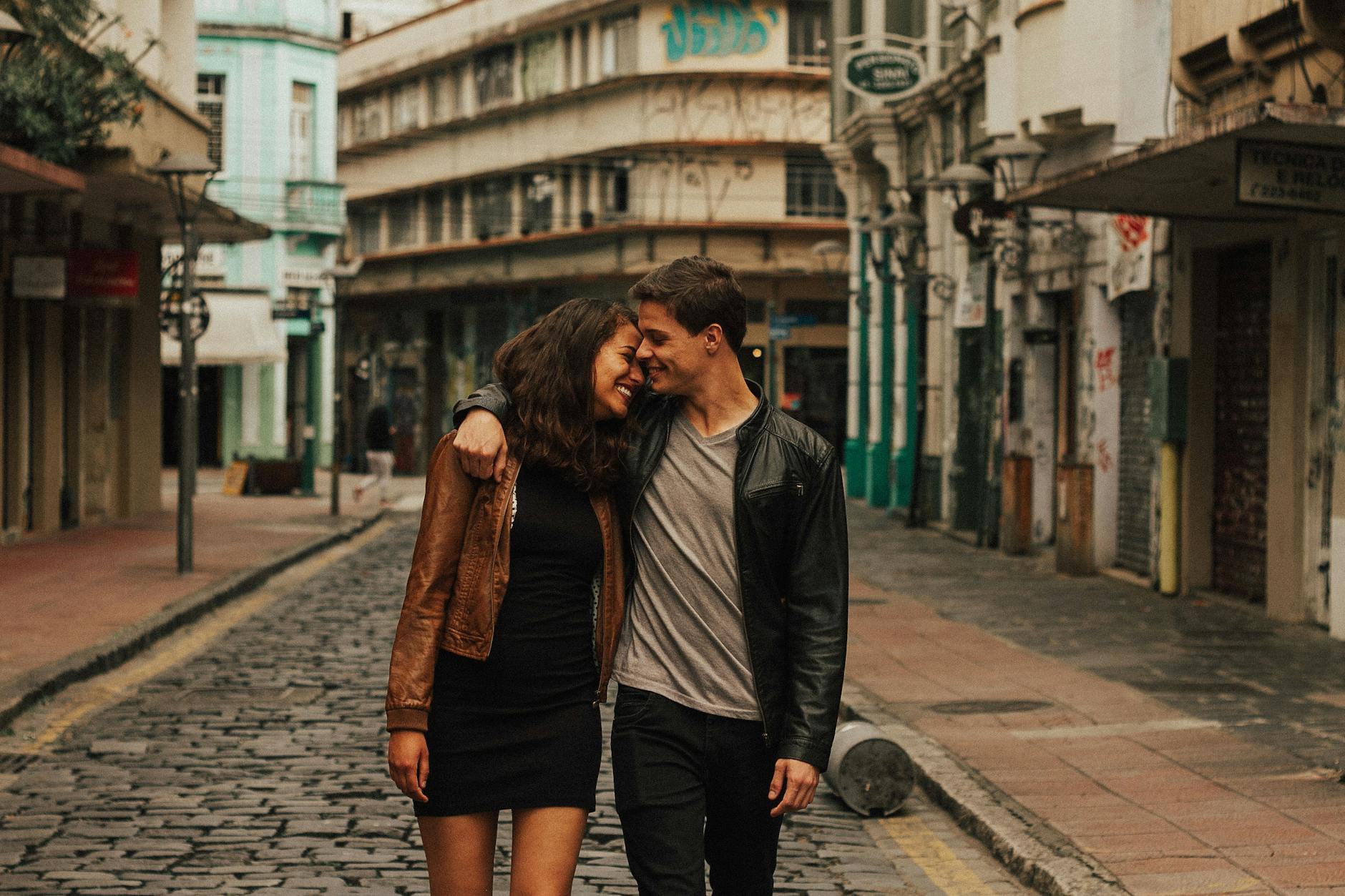 Young budget travellers exploring a city centre on foot near their hostel