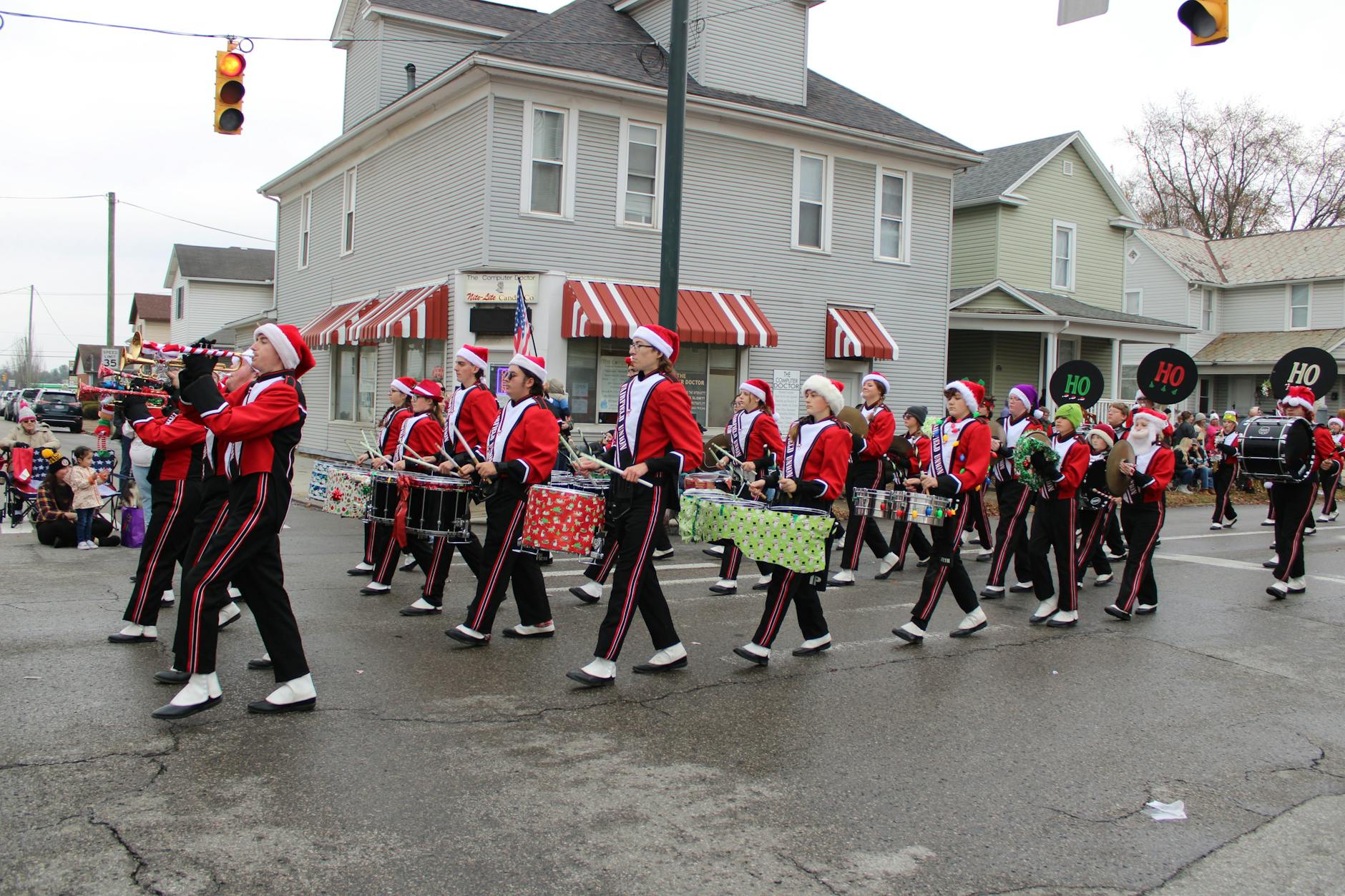 Floats and marching bands at a Christmas pageant parade through the city