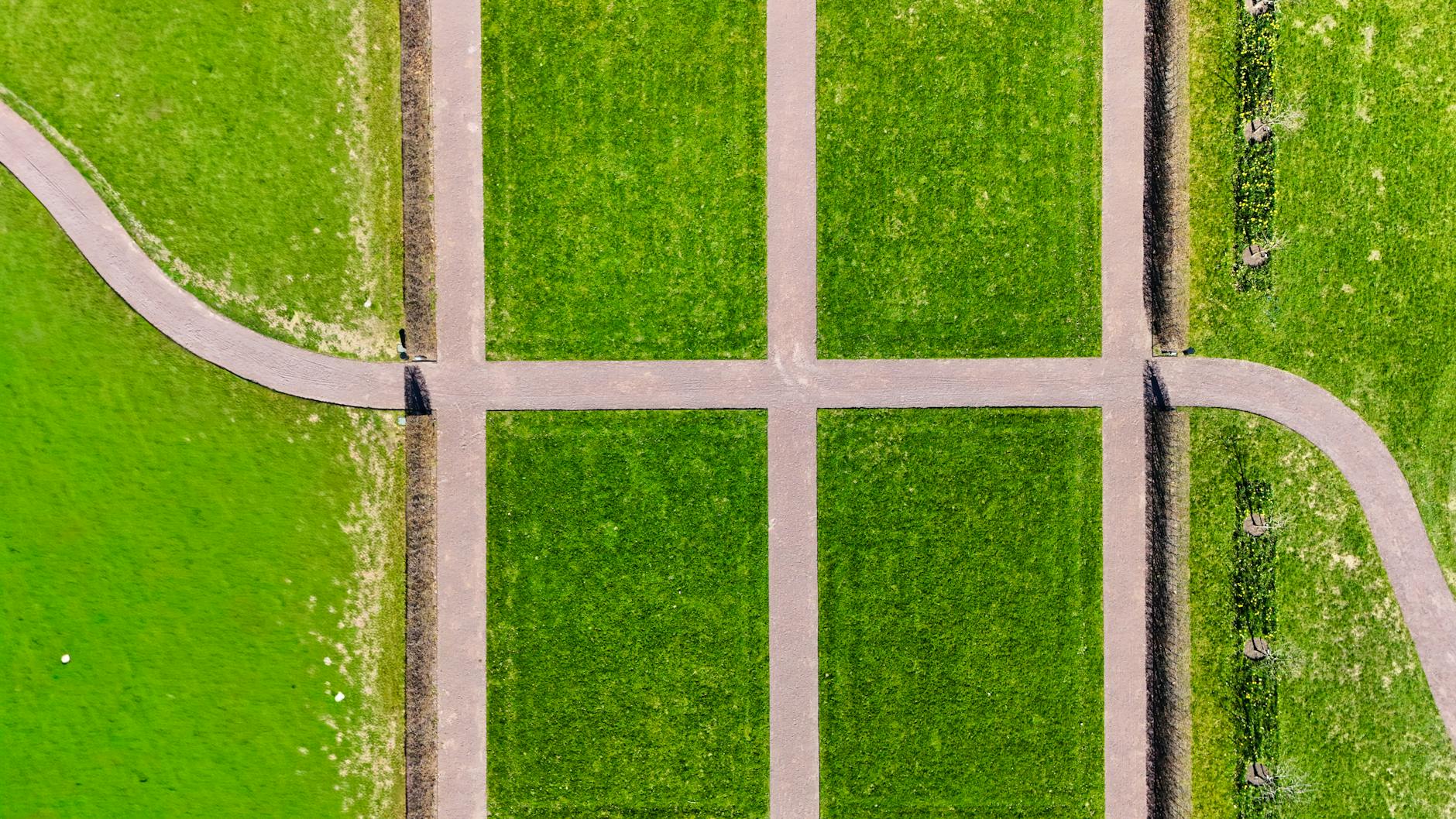 Aerial view of Adelaide's grid layout ringed by green Park Lands, Colonel Light's city plan