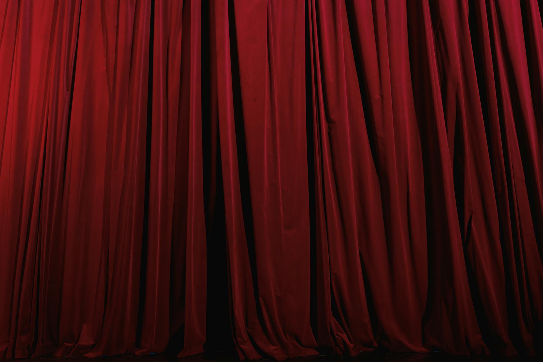 Red velvet theatre curtain with gold trim at Her Majestys Theatre Adelaide