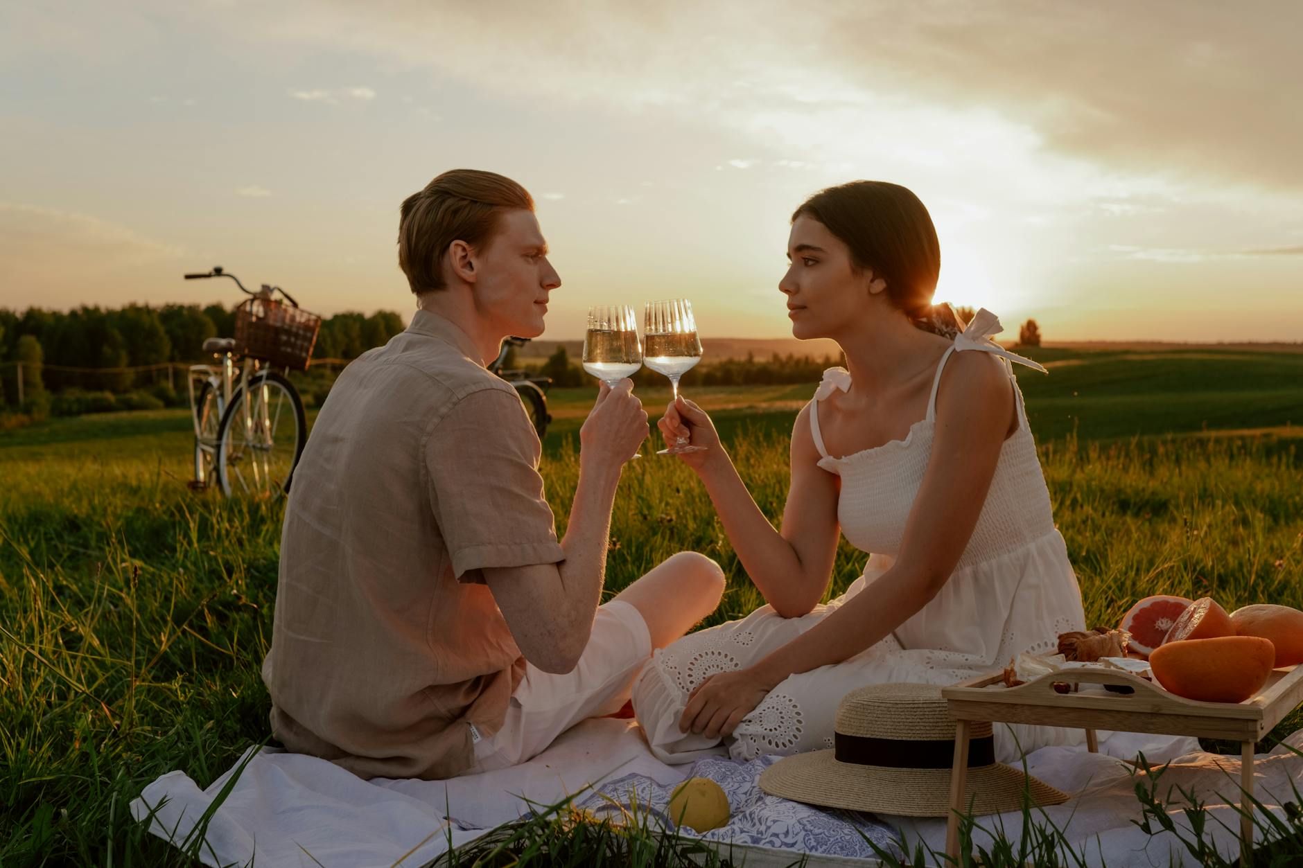 Couple sharing a golden-hour picnic in a park in Adelaide