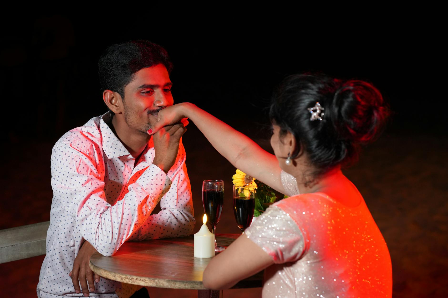 Couple enjoying a candle-lit dinner on an Adelaide date night
