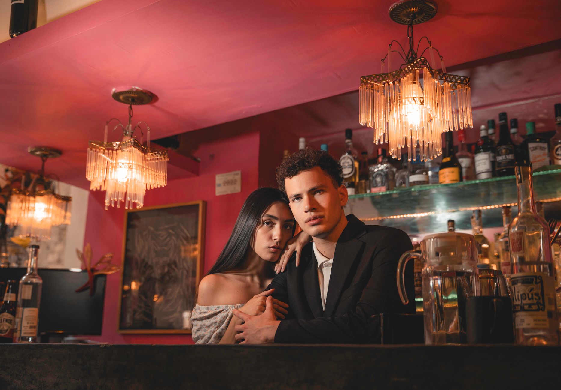 Couple sharing cocktails at a bar on a night out in Adelaide