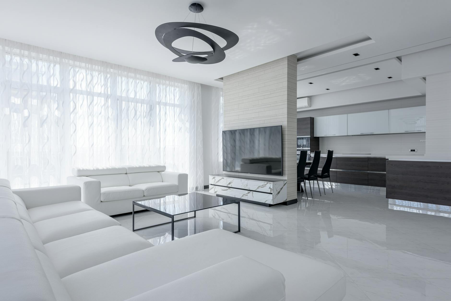 Open-plan living room and kitchen of a family apartment hotel in Adelaide