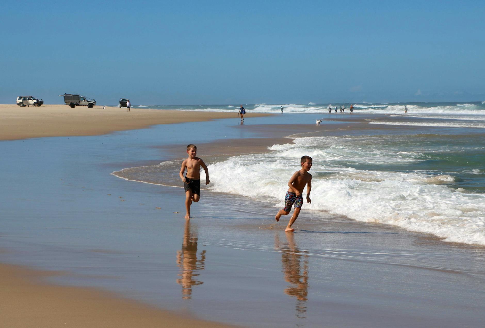 A family enjoying a sandy Australian beach holiday near Adelaide