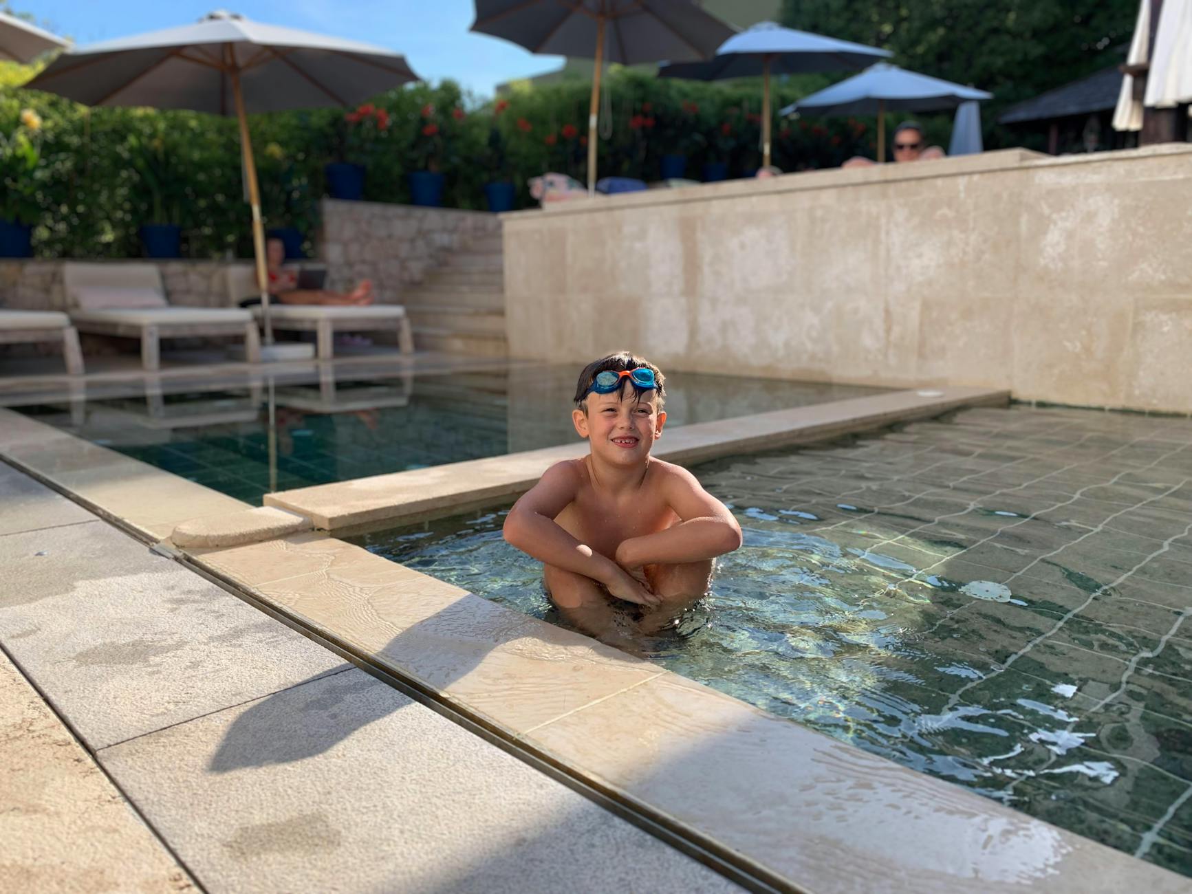 Children enjoying a hotel swimming pool, a key feature for Adelaide family hotels