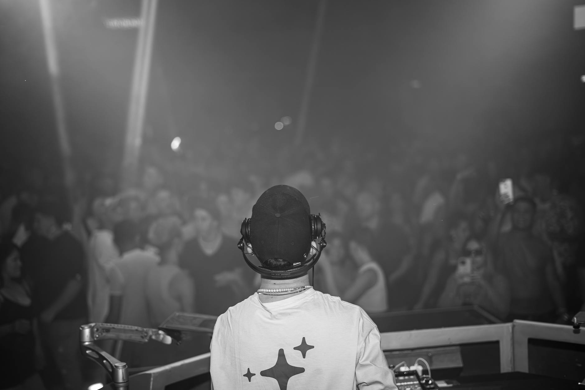 A DJ performing to a packed crowd at an Adelaide nightclub