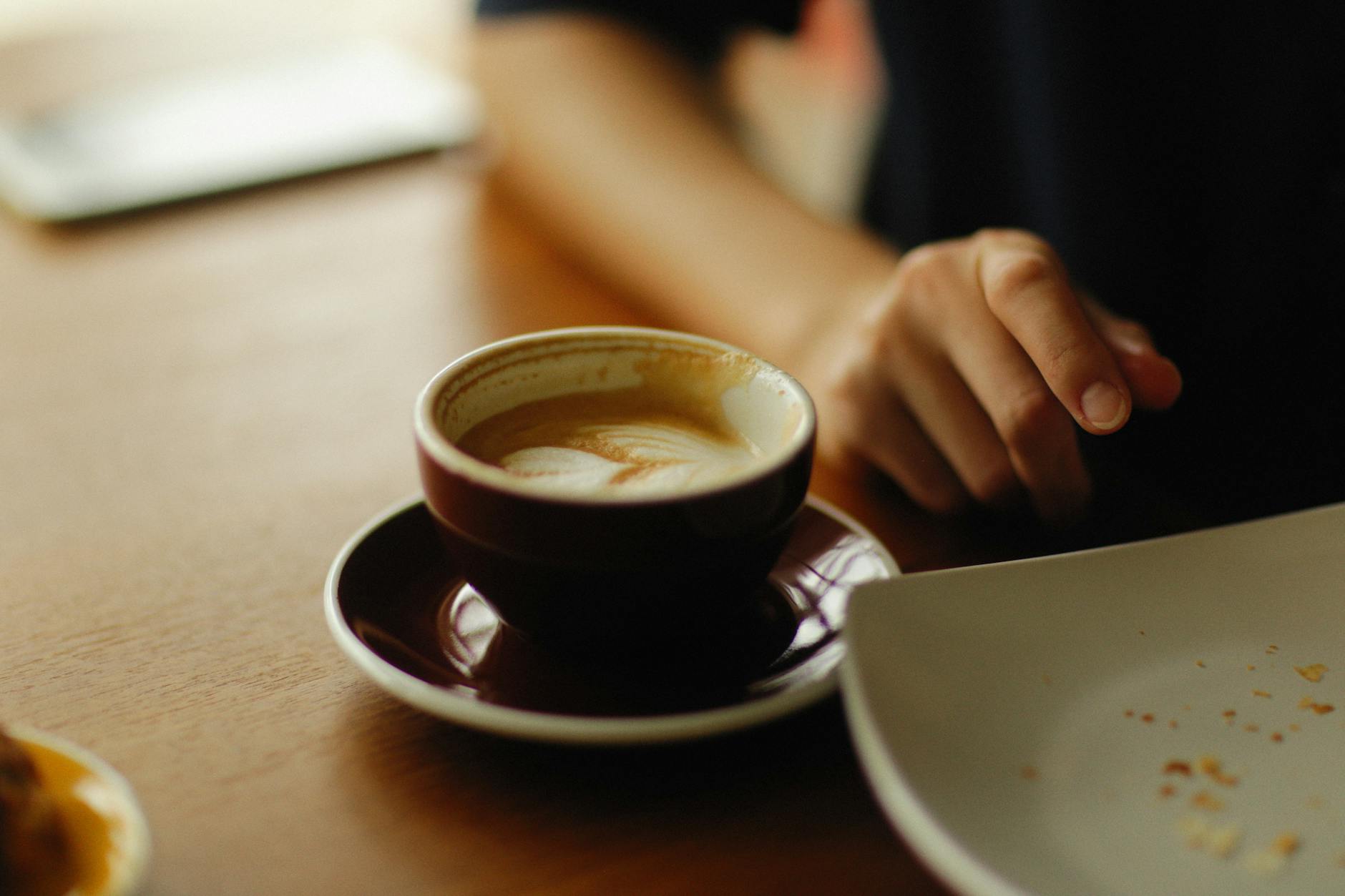 A solo traveller enjoying a coffee at an Adelaide laneway cafe
