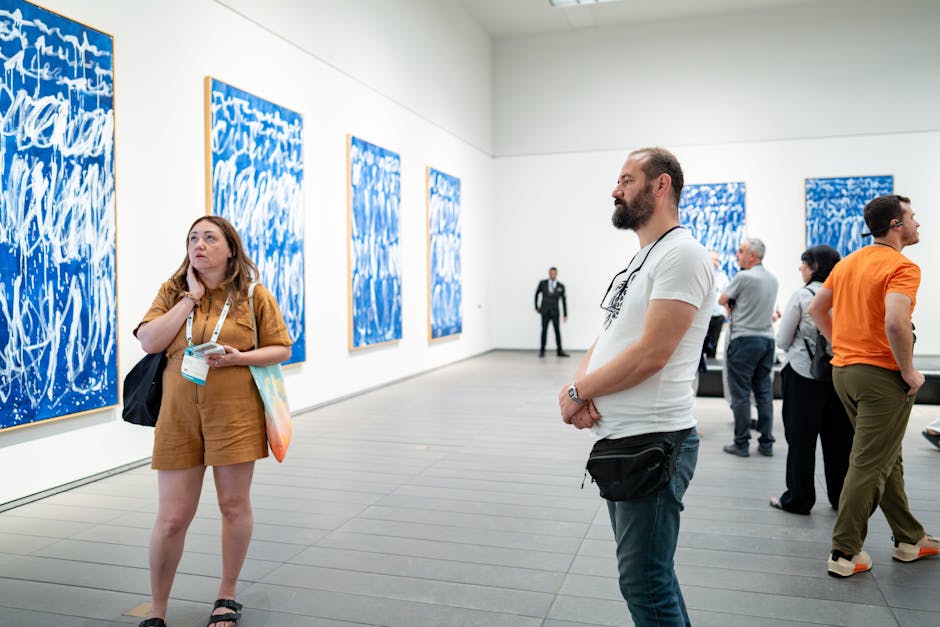 Visitors enjoying guided tour through Art Gallery of South Australia exhibition spaces