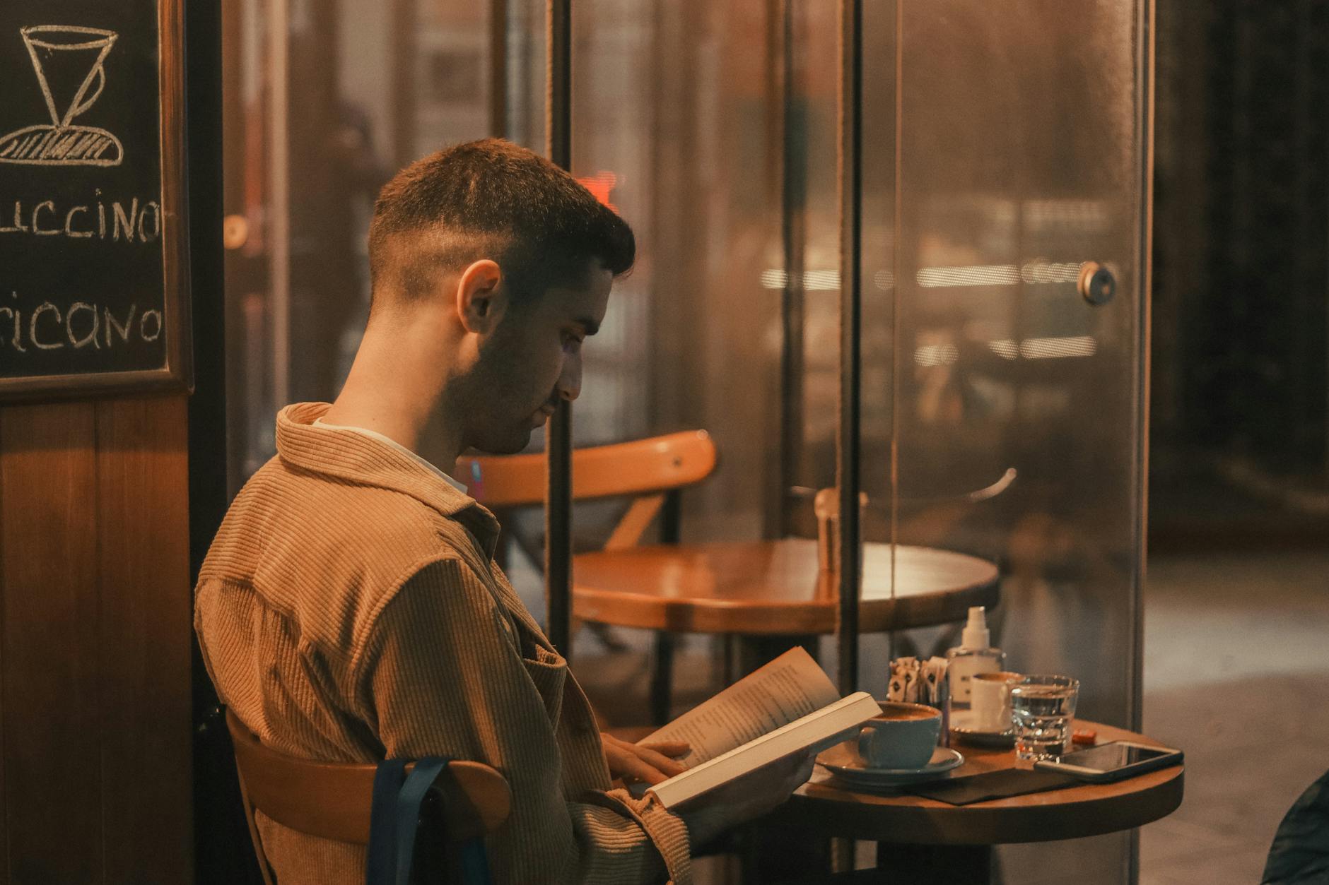 A reader with a book at a cafe, Adelaide Hills bookshop culture