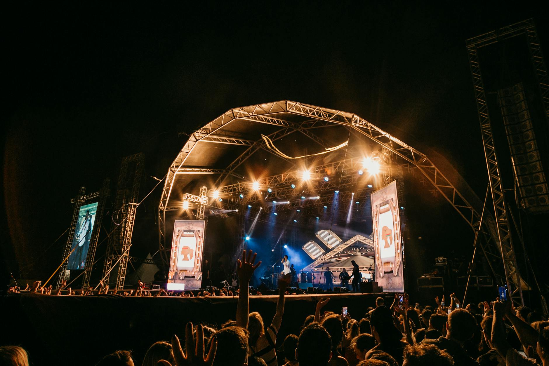 Evening performance at WOMADelaide with stage lighting and enthusiastic audience