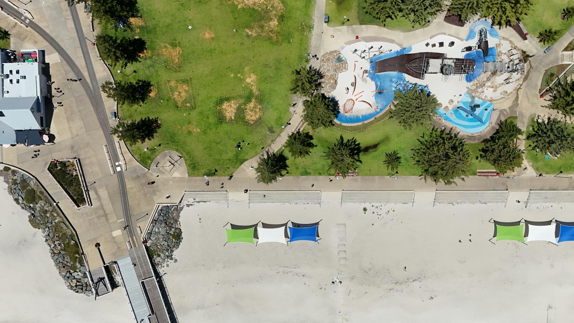 Beachside playground on the foreshore with family enjoying outdoor play