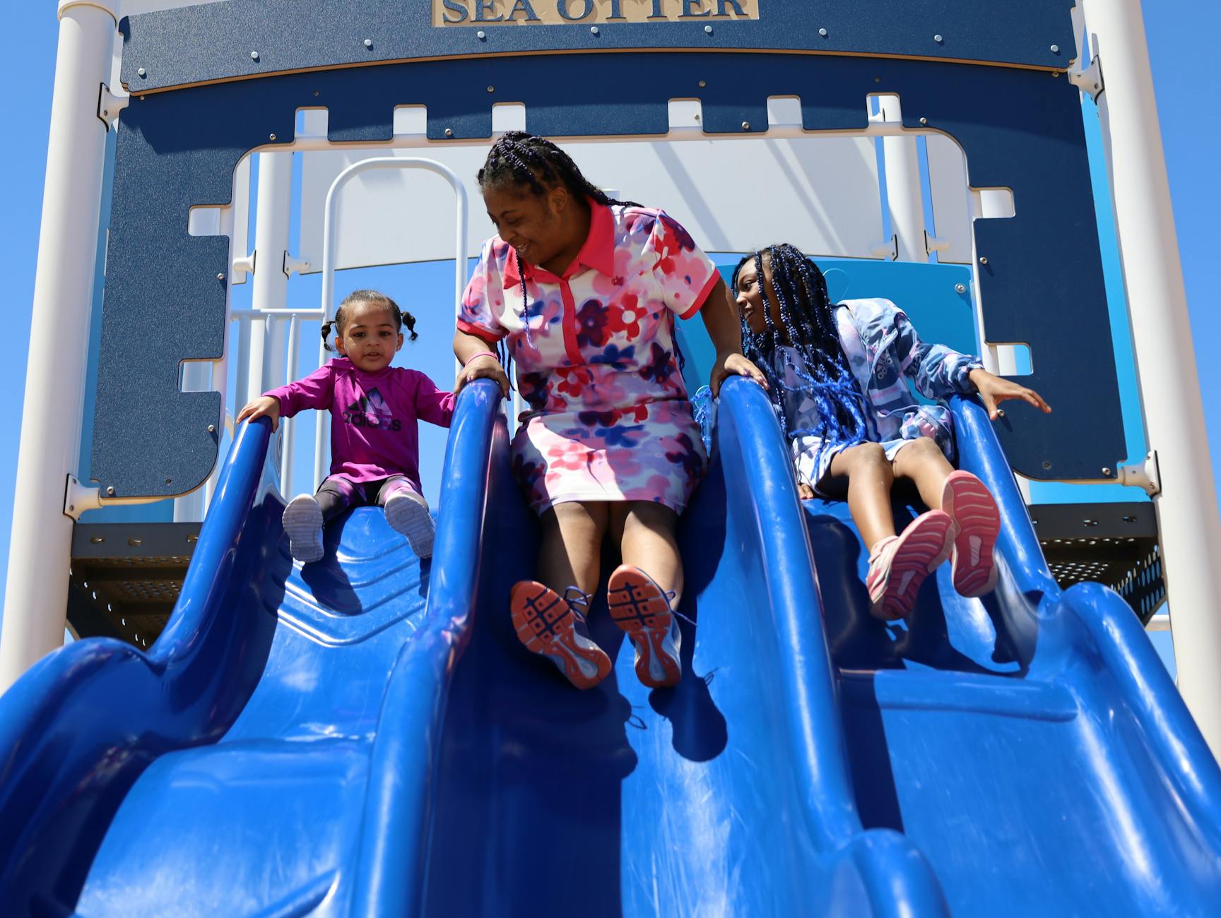 Happy family enjoying outdoor play at an Adelaide park and playground