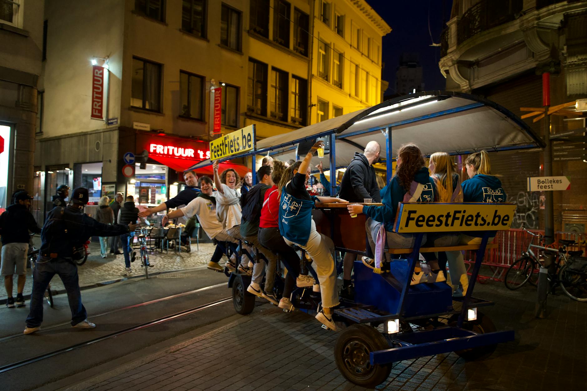 Friends enjoying a bar crawl through Adelaide city laneways at night