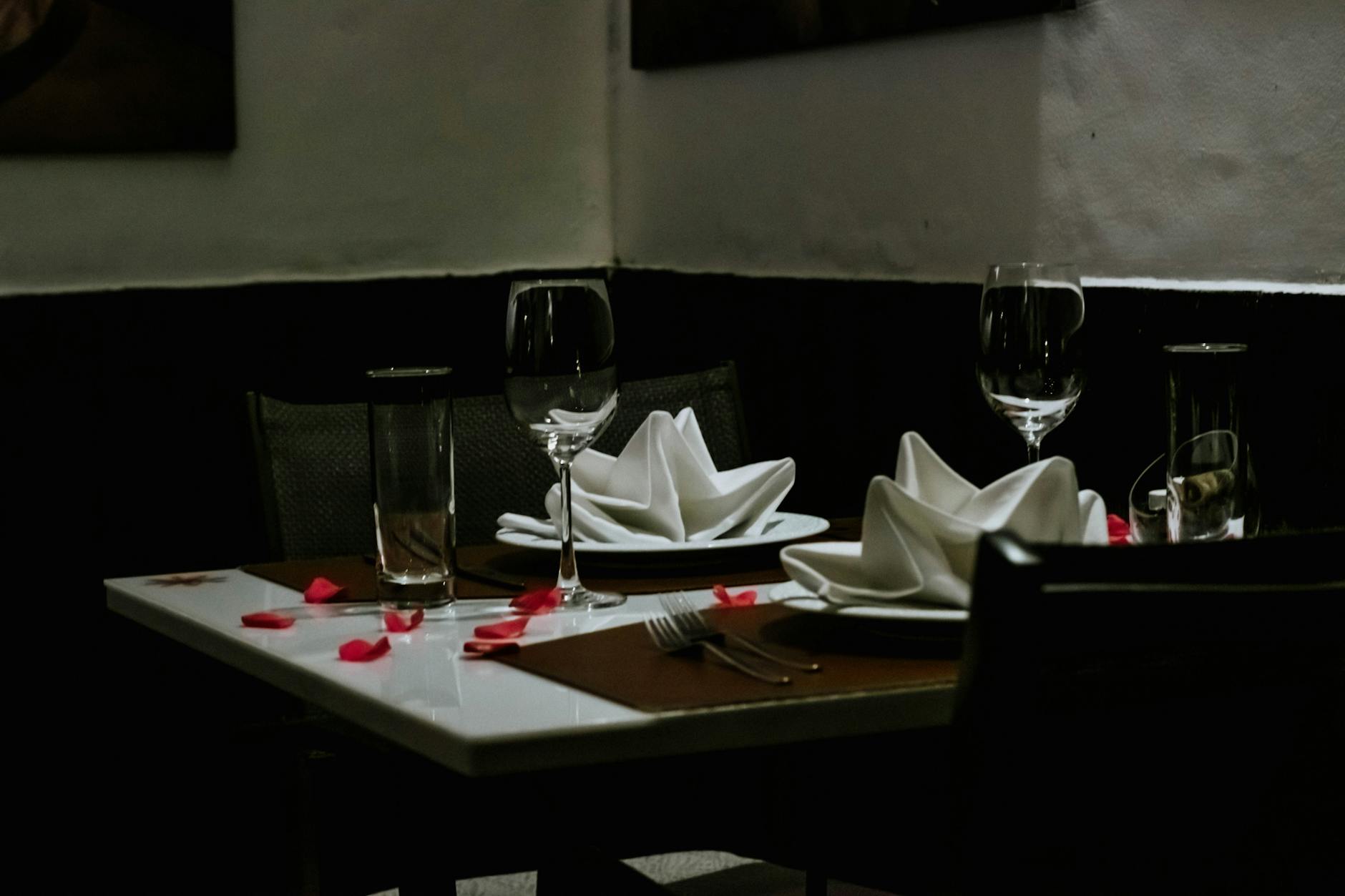 Candlelit table set for two at a romantic Adelaide fine-dining restaurant
