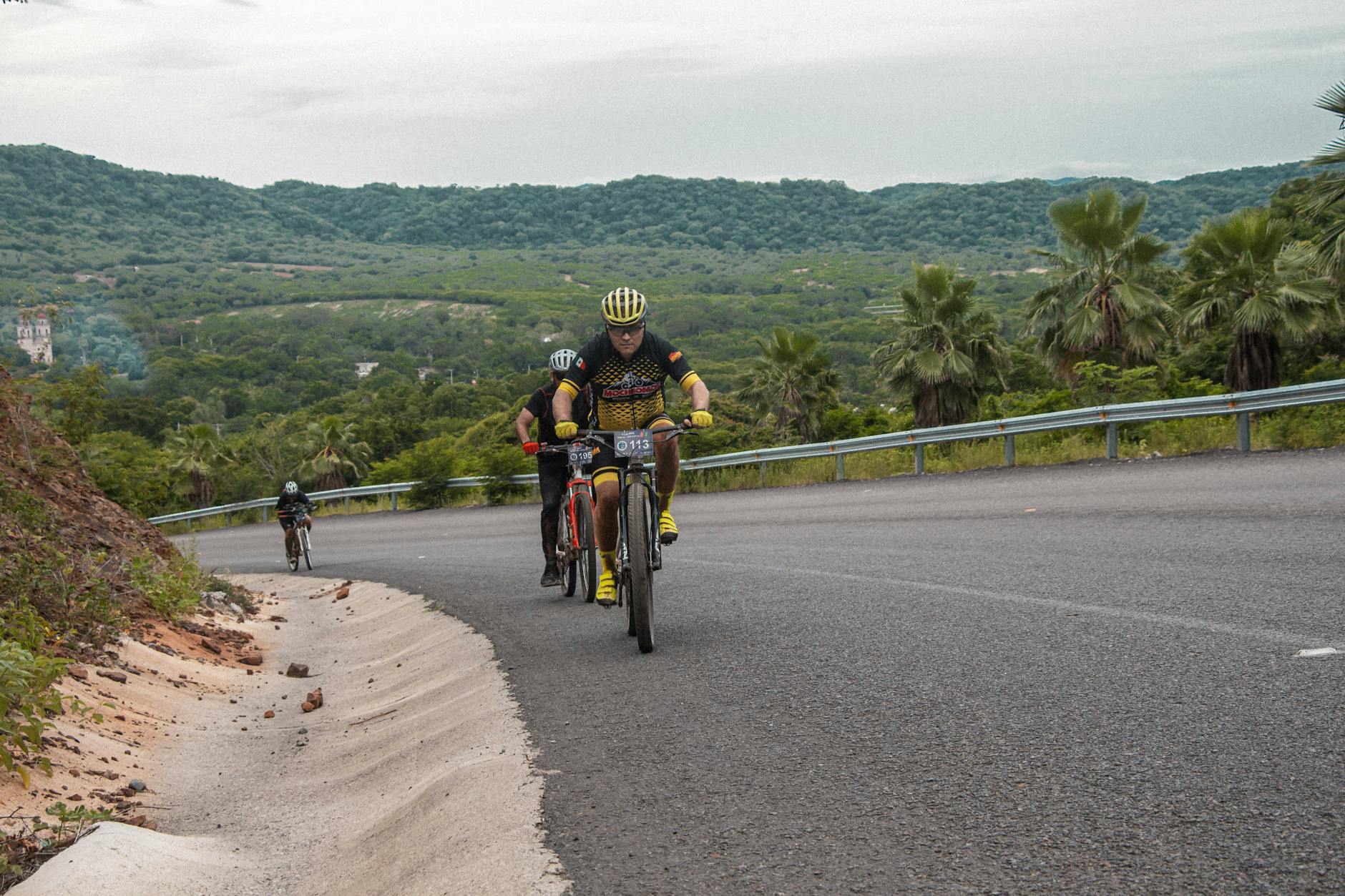 Cyclists climbing a steep hill on a Tour Down Under stage near Adelaide