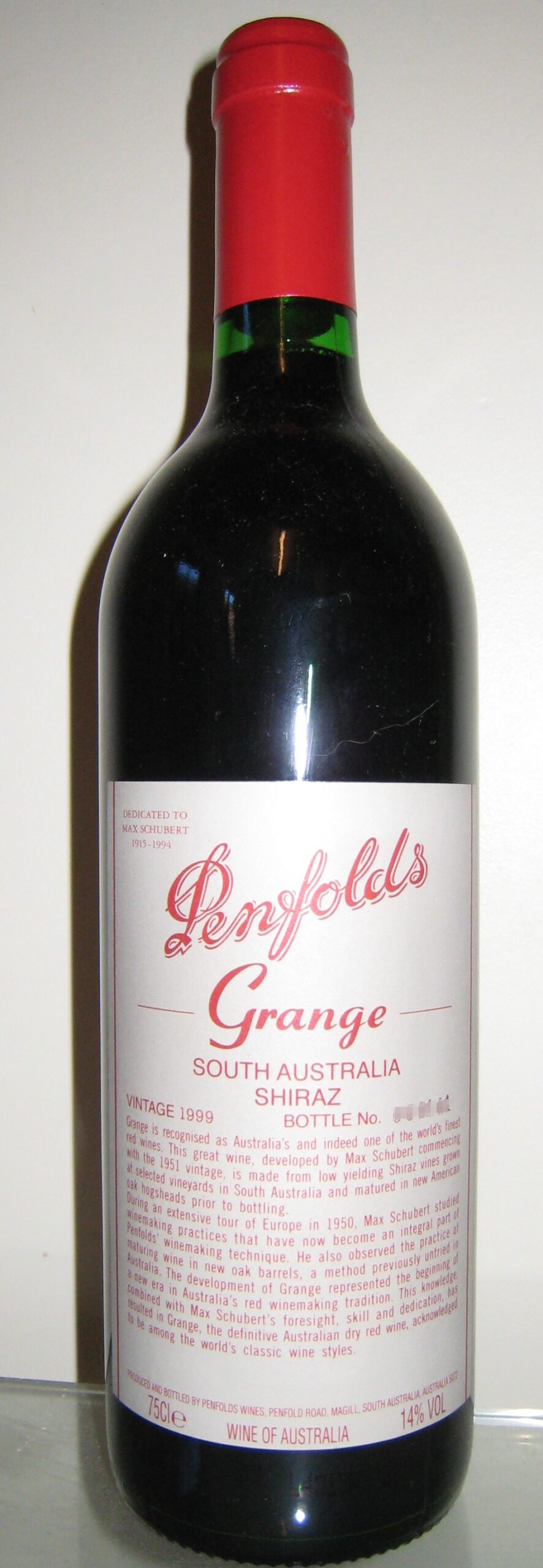 A bottle of Penfolds Grange South Australia Shiraz with its white label and red capsule