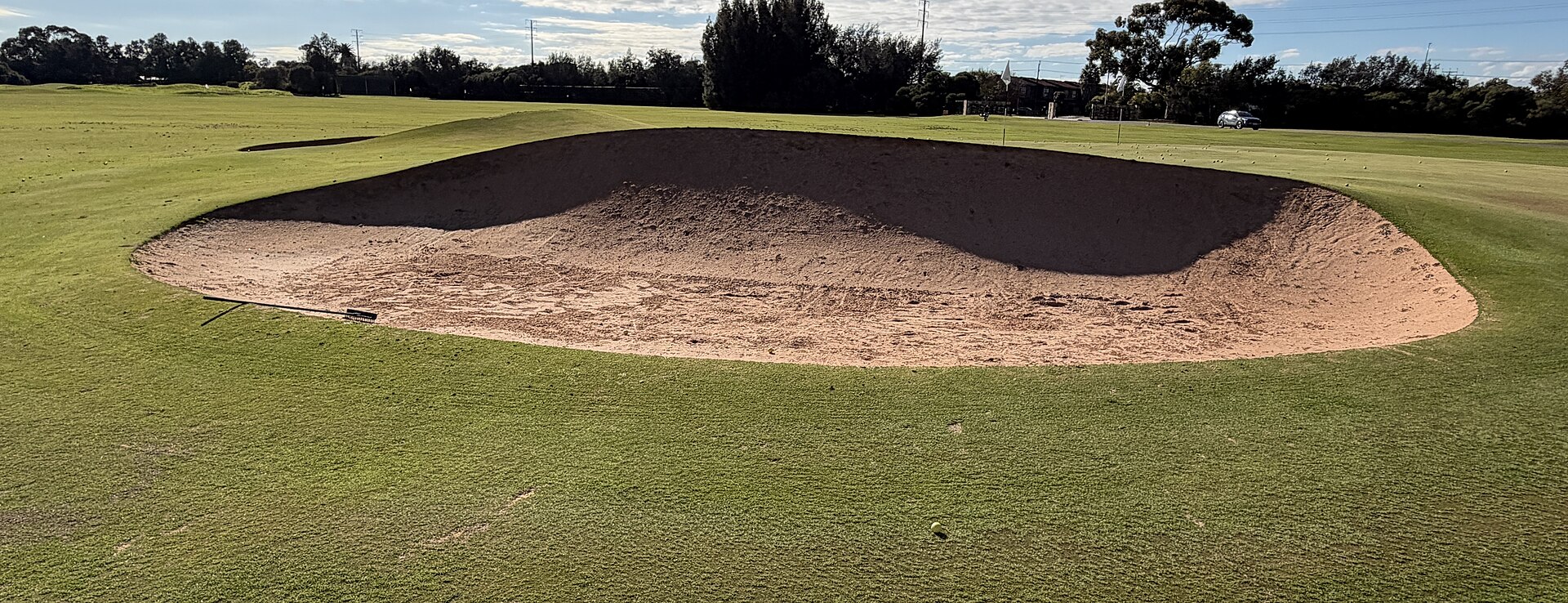 A deep sand bunker cut into a green fairway at Royal Adelaide Golf Club in Seaton